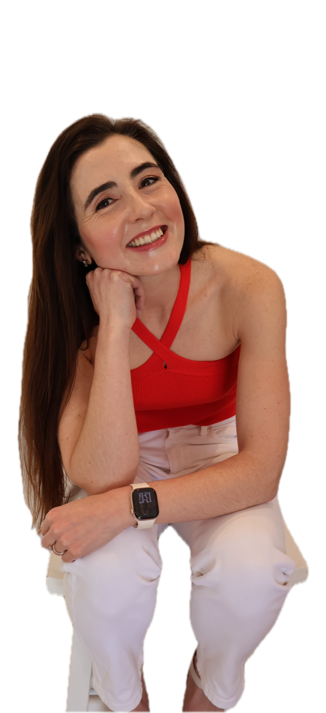 Monet Ferreira smiling, seated with her head and arms fully visible